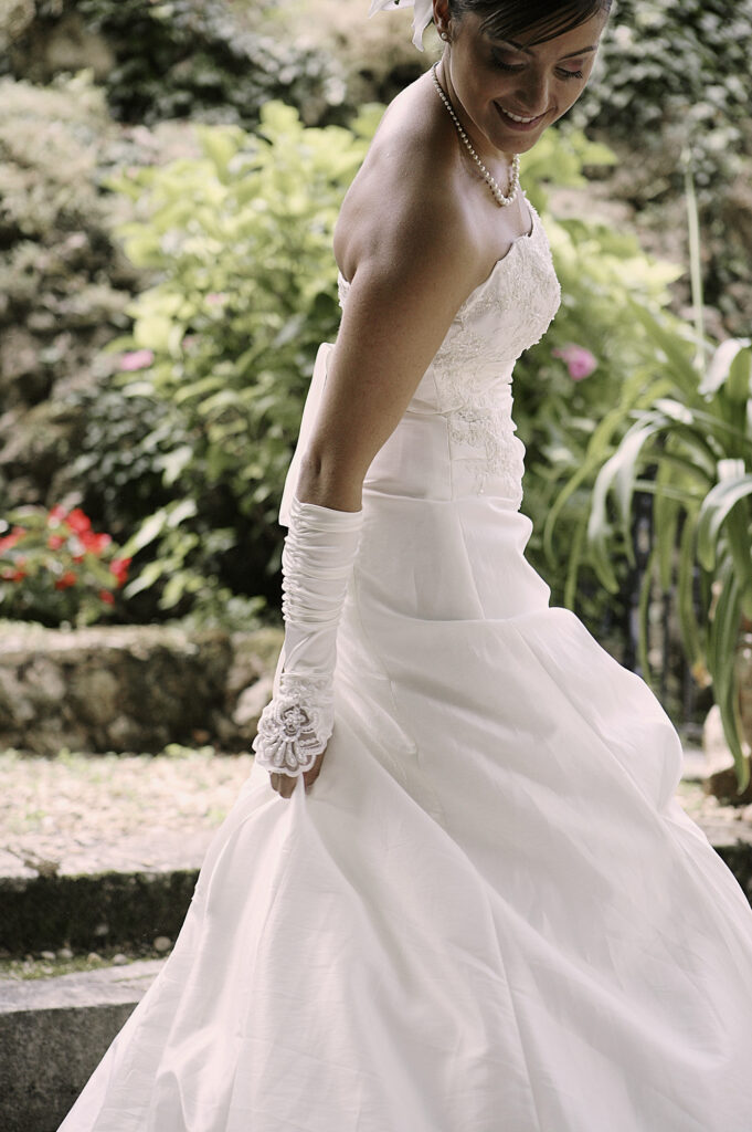 Bride walking through the garden in her wedding dress