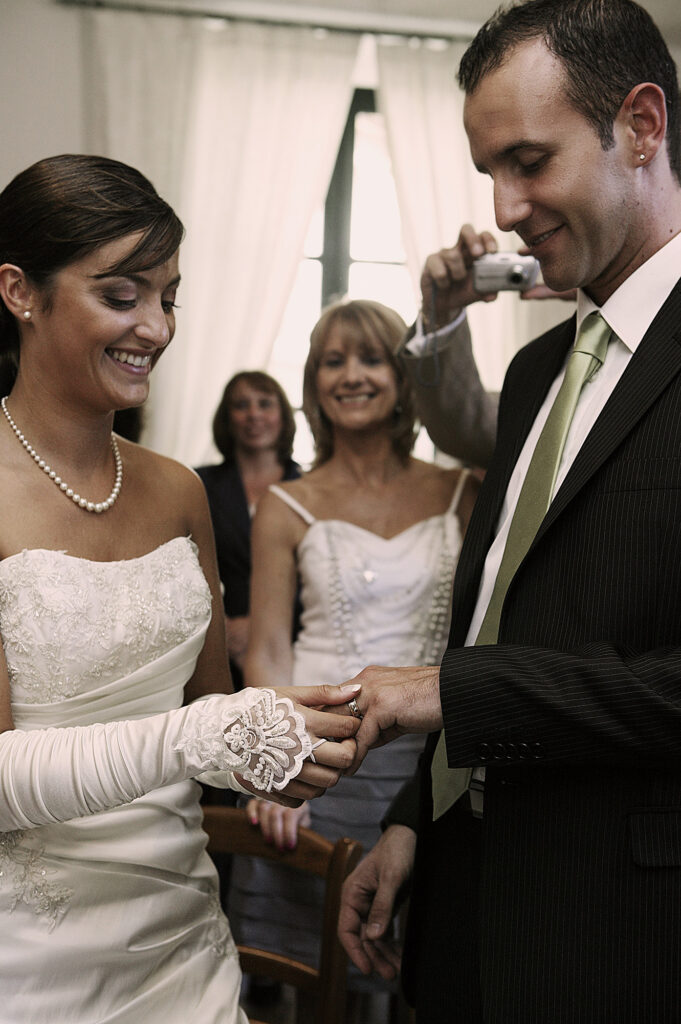Bride and groom exchanging wedding rings during the ceremony