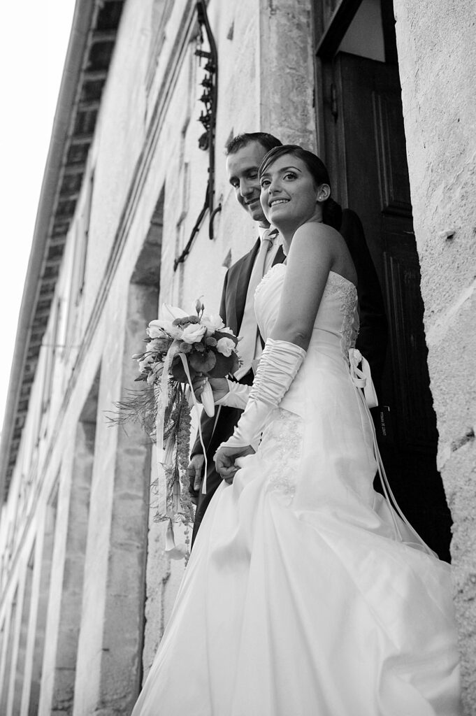 Bride and groom standing together outside the wedding ceremony