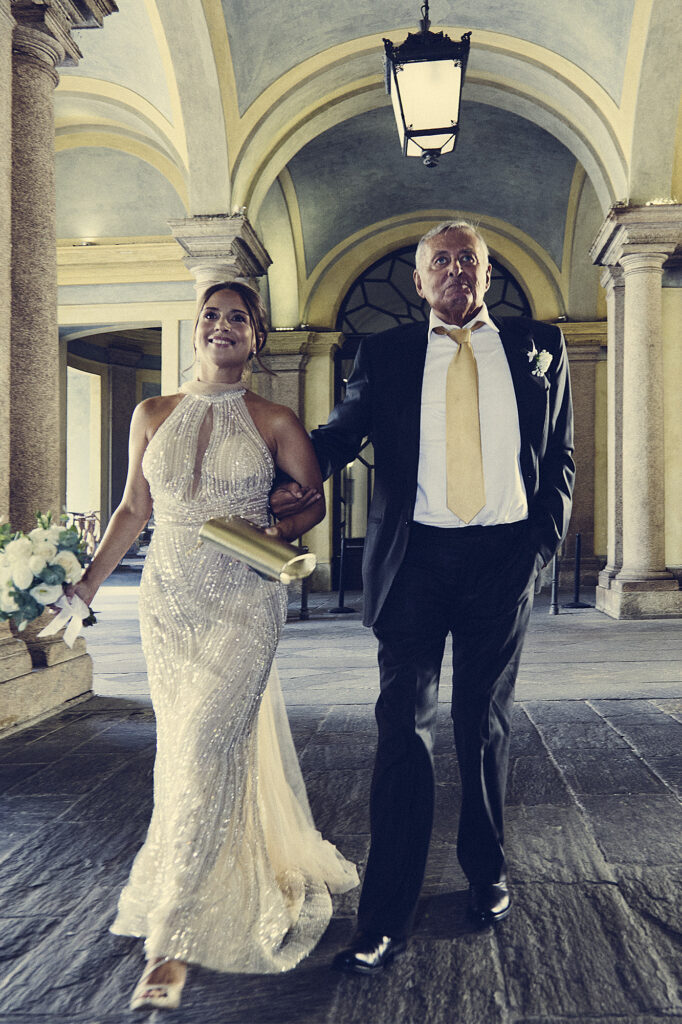 Bride walking with her father before the wedding ceremony
