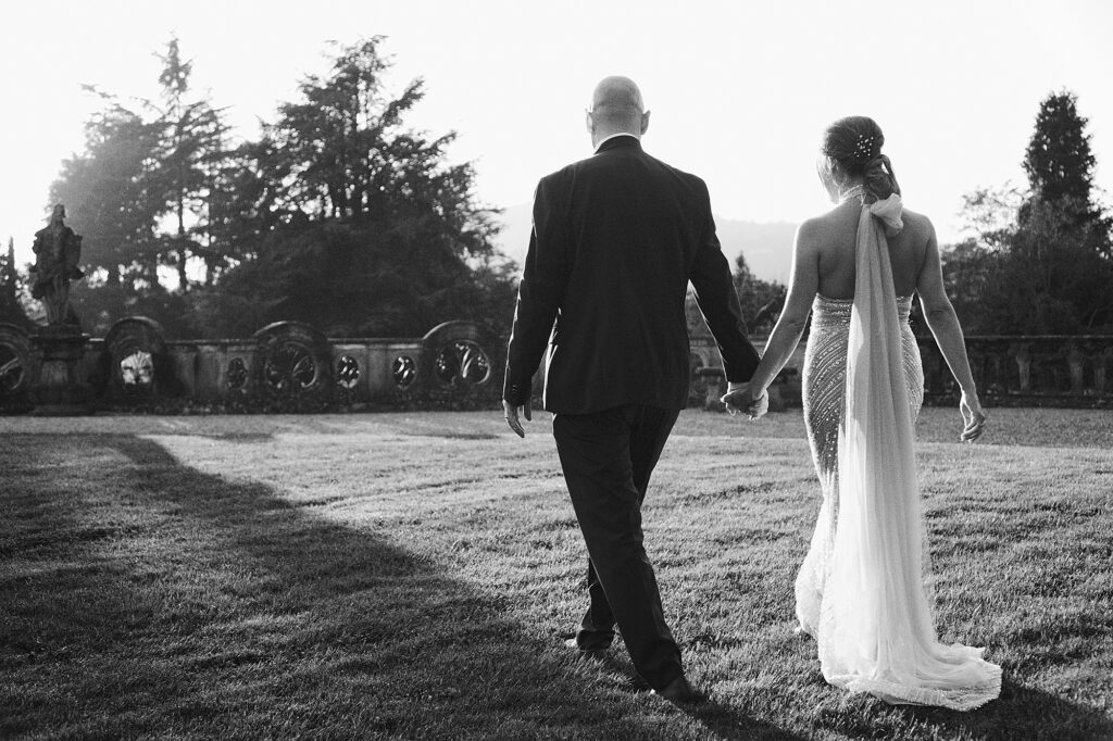 Bride and groom walking hand in hand after the wedding ceremony