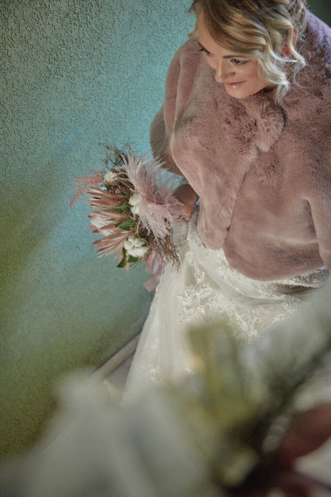 Bride holding her wedding bouquet photographed from above