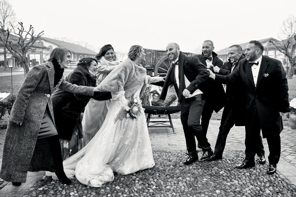 Bride and groom celebrating with friends in a spontaneous wedding moment